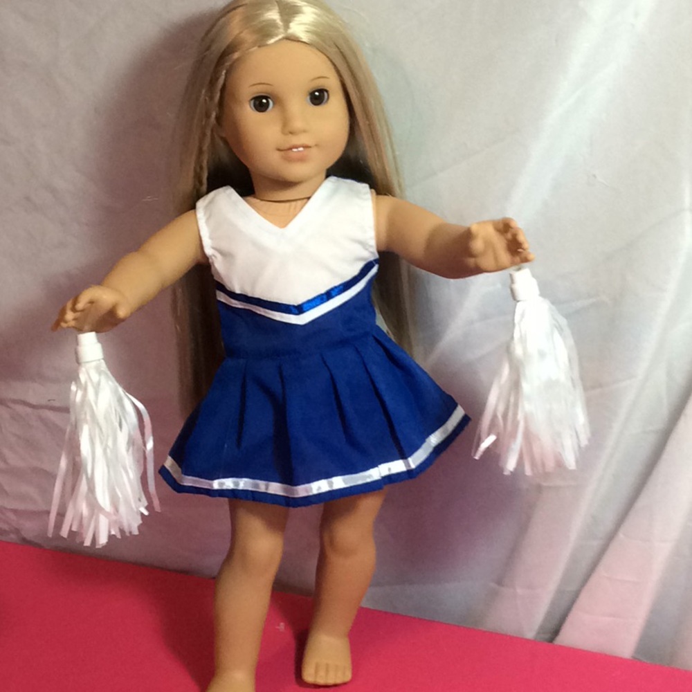 American girl cheerleader with pompoms
